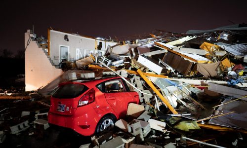A car is buried under rubble on Main Street after a tornado hit Hendersonville, Tennessee, U.S. December 9, 2023.  Andrew Nelles/USA Today Network via REUTERS